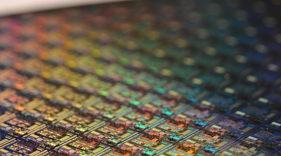 Macro shot of a silicon wafer, the kind of custom AI chip at the center of the Marvell-Google chip deal